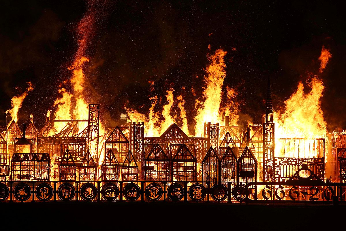 A 120-meter long model of the 17th century London skyline is set alight on the River Thames to commemorate the 1666 Great Fire of London in London